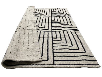 KEVO - Tapis rectangulaire en coton avec motifs beiges et noirs 120 x 180 cm